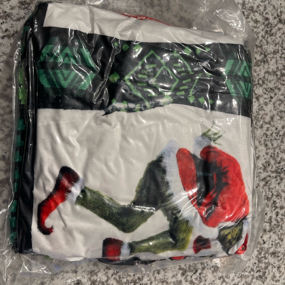 Grinch throw over blanket
